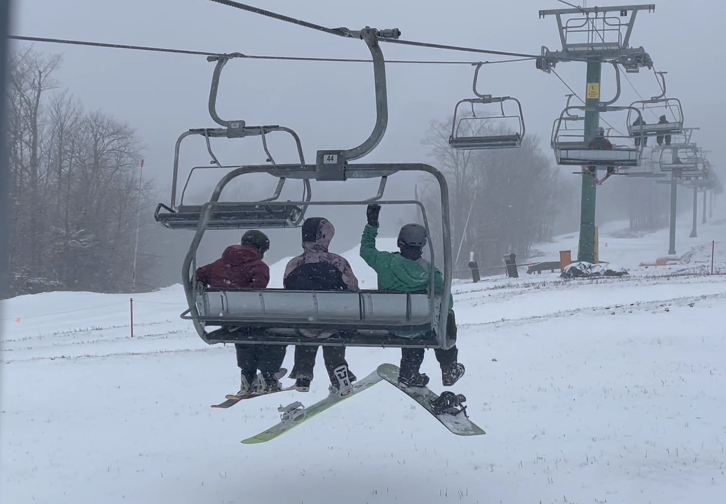 Chairlift crossing a snowy mountain